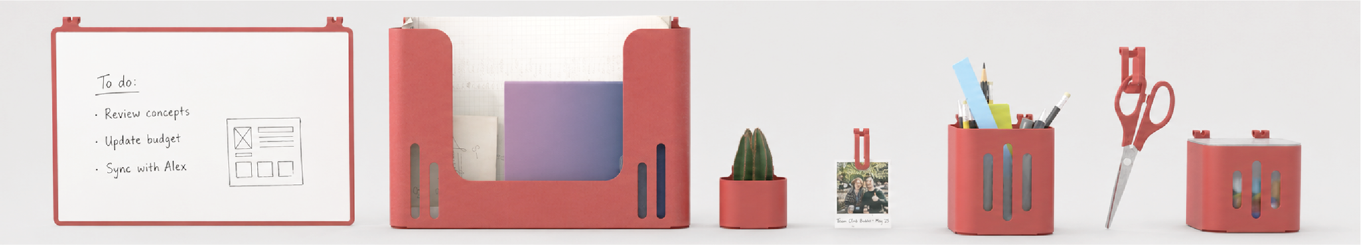 Panoramic view of the full modular accessory set: whiteboard, file holder, planter, photo clip, pencil cup, scissors and storage container