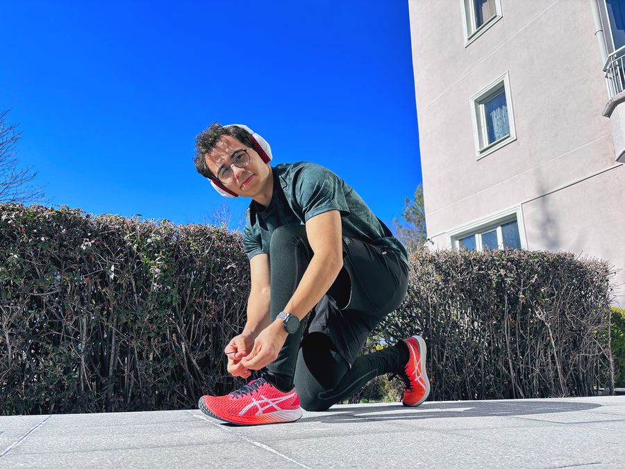 Headphone worn while tying running shoes